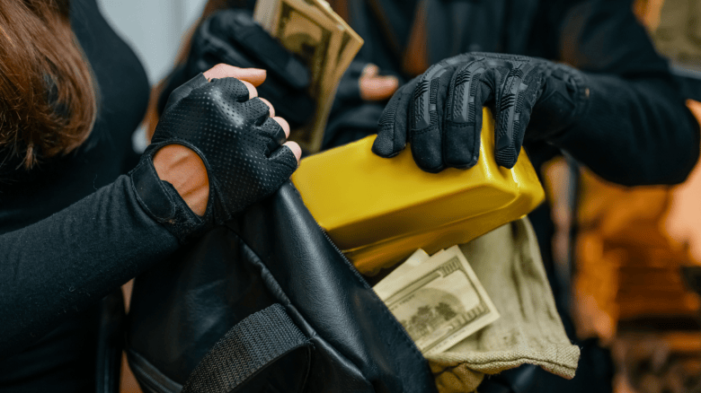 Bank robbers filling a bag