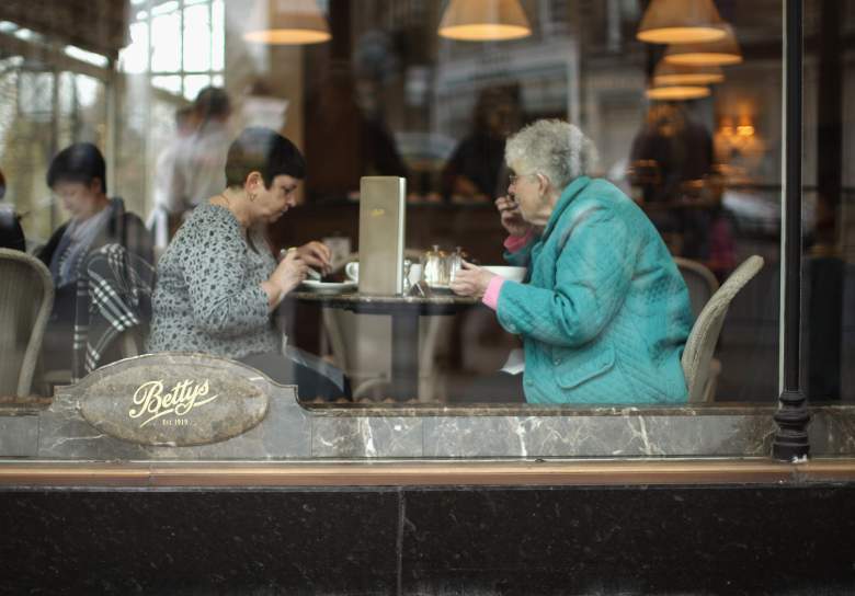 Two women share a meal at a restaurant in England.