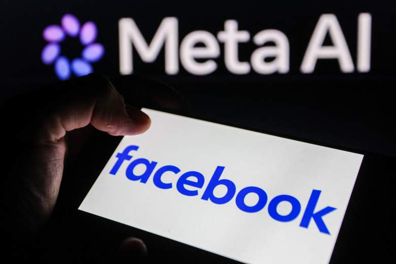 Facebook logo on smartphone in front of the Meta AI logo.