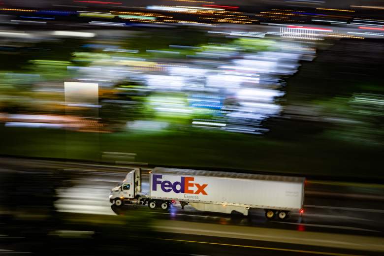 A FedEx truck travels through the rain along highway I-95 near Secaucus, New Jersey, on July 5, 2026.