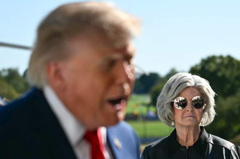 White House Chief of Staff Susie Wiles (R) looks on as US President Donald Trump speaks to the press before walking to board Marine One on the South Lawn of the White House in Washington, DC, on October 6, 2026. President Trump is traveling to Sparrows Point, Maryland where he will speak at Anduril Industries.