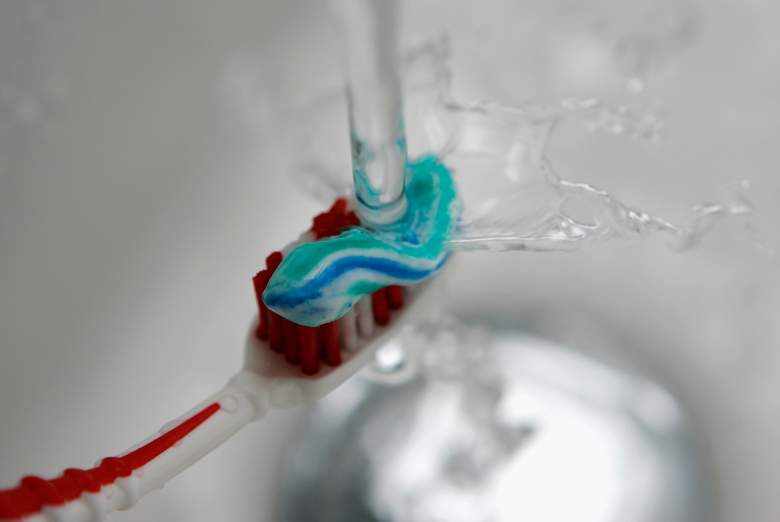 SCHWELM, GERMANY - JANUARY 10:  Water pours onto a toothbrush with toothpaste on January 10, 2007 in Schwelm, Germany. 