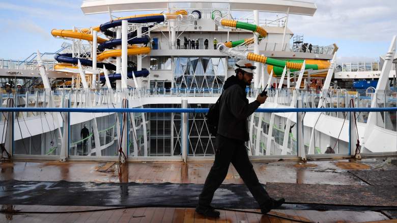 A worker walks across the upper deck of US shipowner Royal Caribbean's new Oasis-class cruise ship, Symphony of the Seas, the largest passenger ship ever to be constructed by gross tonnage and built by French shipyard STX, on February 13, 2018 in the port of Saint-Nazaire, western France. STX, whose origins date to 1861, has several cruise ships on order between now and 2026 for its two main clients, MSC Cruises and Royal Caribbean. Italian shipbuilding company Fincantieri announced on Februay 2, 2018 it had reached an agreement with France to buy 50 percent of the French shipyard STX. Symphony of the Seas is to be delivered to the Royal Caribbean by March, and will be able to accommodate 5,518 passengers at double occupancy up to a maximum capacity of 6,680 passengers, as well as a 2,200-person crew.